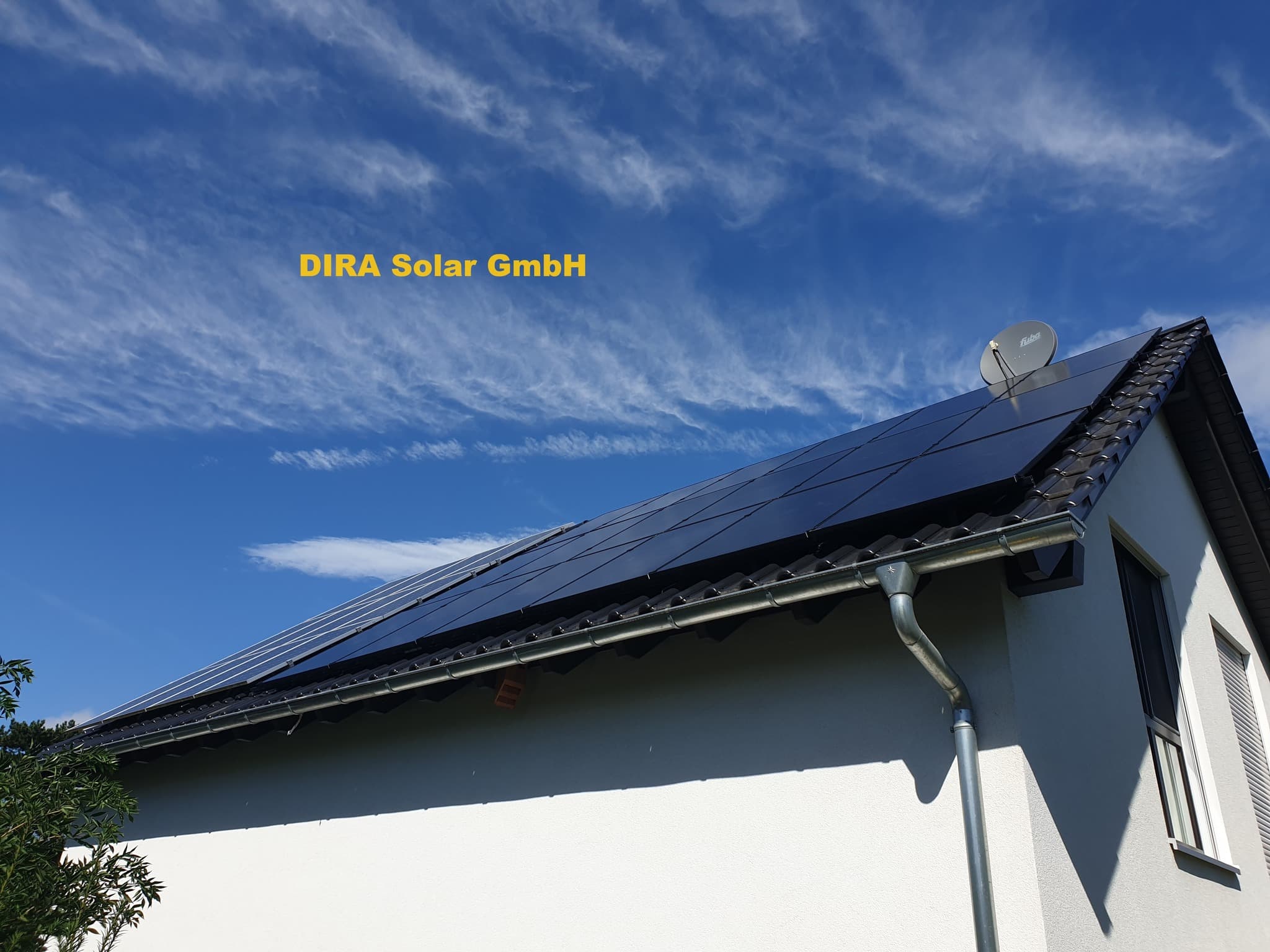 Solar panels on a house roof at sunset